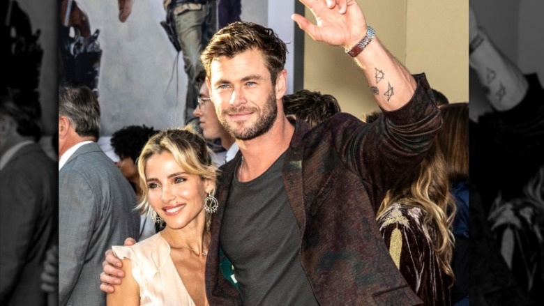 Elsa Pataky and Chris Hemsworth waving