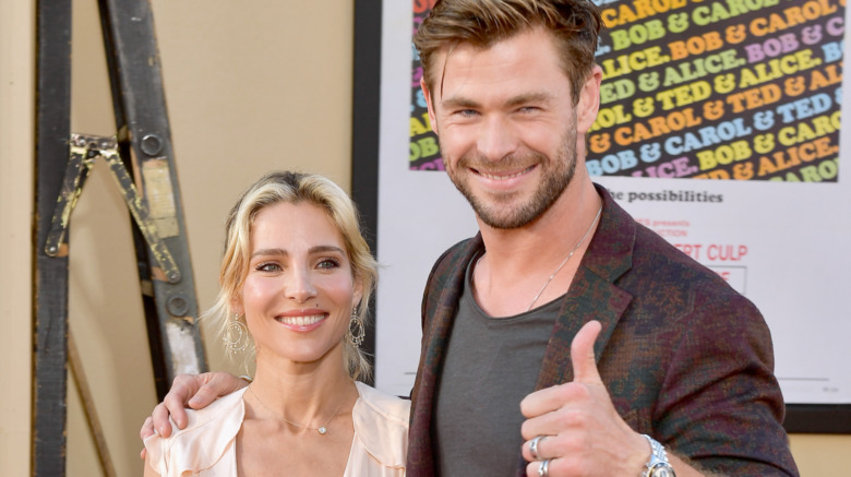 Elsa Pataky and Chris Hemsworth giving thumbs up