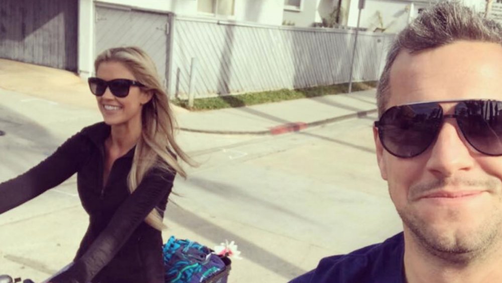 Christina Anstead and Ant Anstead riding bikes in a selfie on Instagram