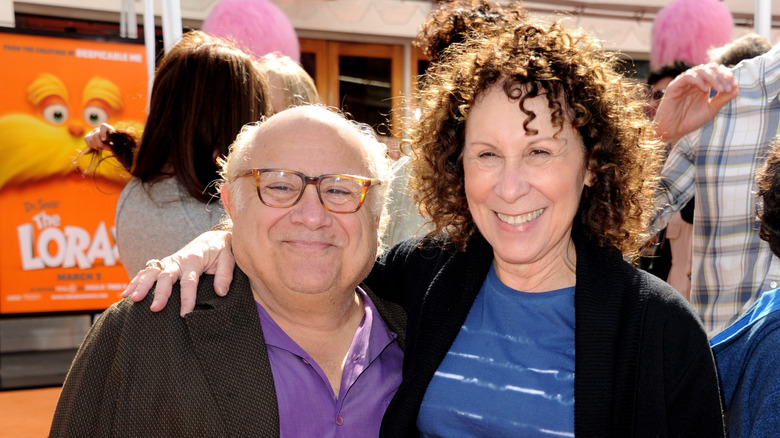 Danny DeVito and Rhea Perlman stand at red carpet event