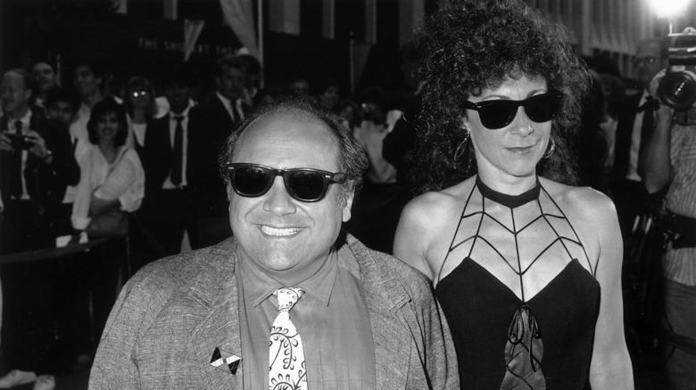 Rhea Perlman and Danny DeVito walk in the '80s