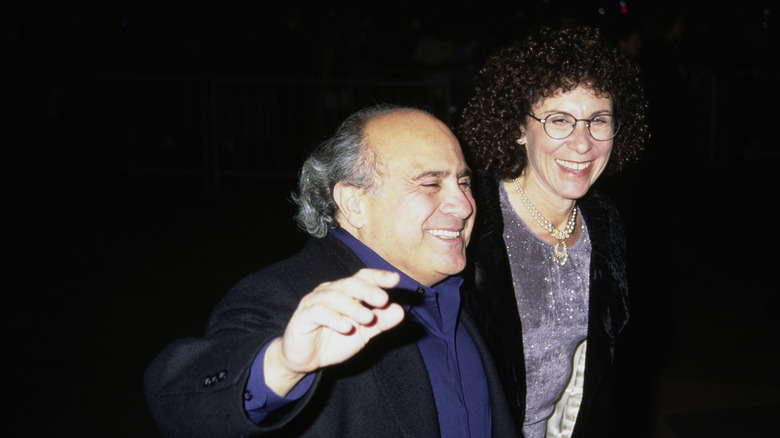 Rhea Perlman and Danny DeVito walk together in the '90s