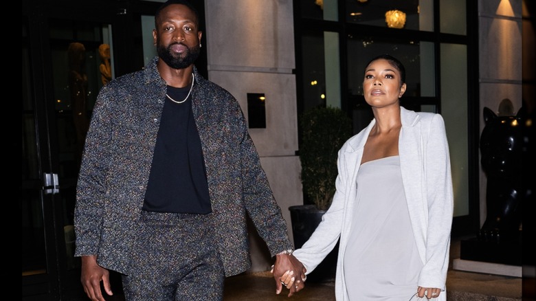 Dwyane Wade and Gabrielle Union hold hands