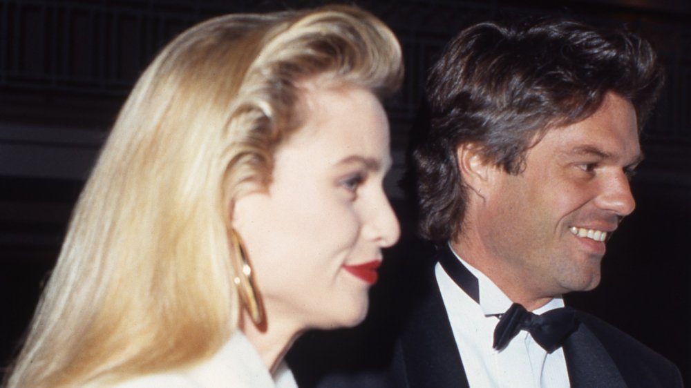 Nicollette Sheridan in white, Harry Hamlin in a black tux, photographed in 1991