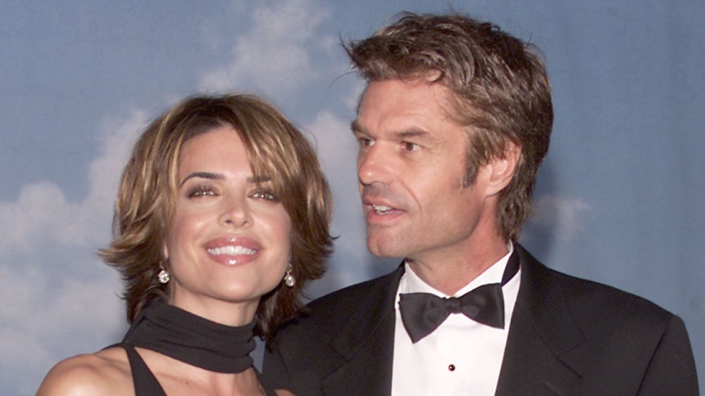 Lisa Rinna and Harry Hamlin, both wearing black, attending a charity gala in 2000