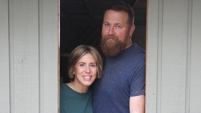 Erin Napier and Ben pose inside window project