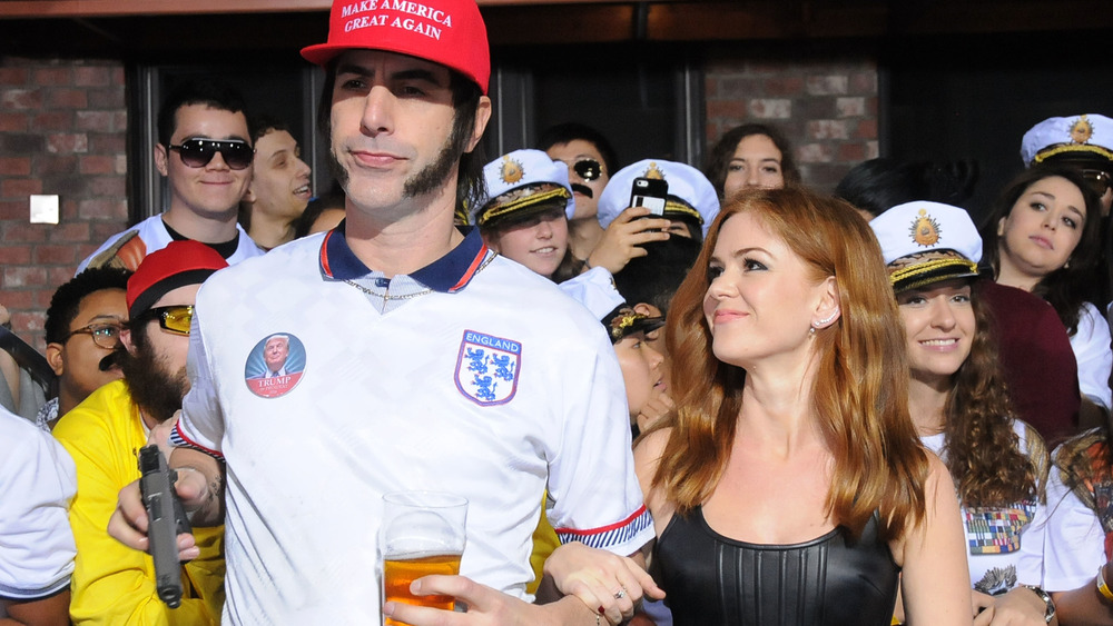 Sacha Baron Cohen in character alongside Isla Fisher at the premiere of The Brothers Grimsby 