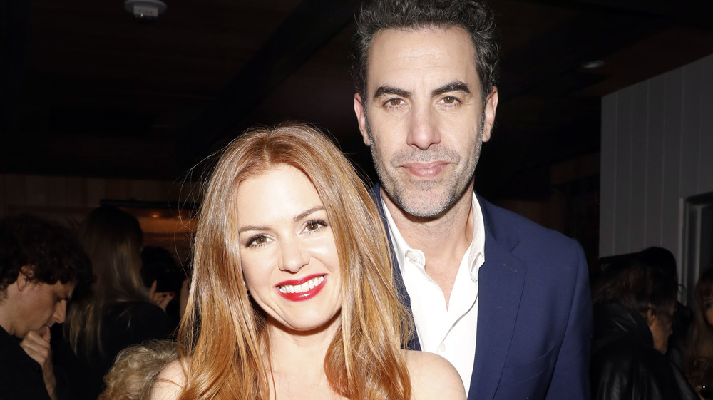 Isla Fisher and Sacha Baron Cohen smiling 