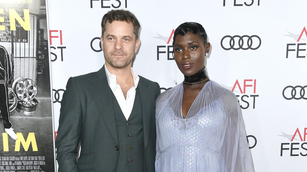 Joshua Jackson, Jodie Turner-Smith posing together on red carpet 