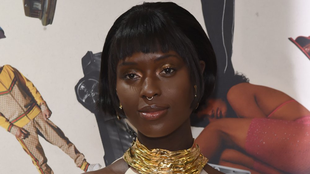 Jodie Turner-Smith with a nose ring and chunky gold necklace