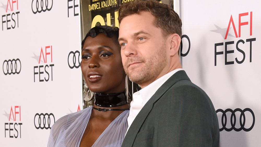 Jodie Turner-Smith in a tulle dress next to Joshua Jackson