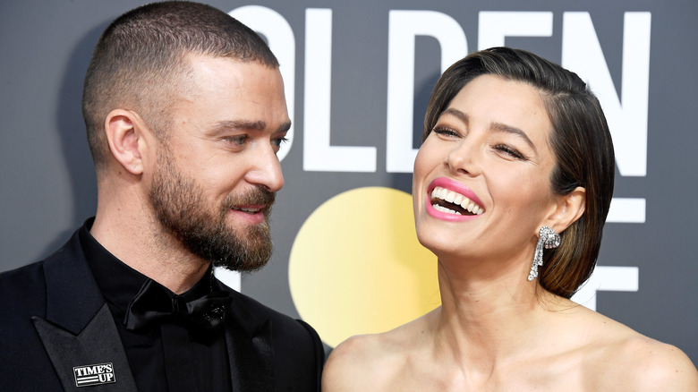 Justin Timberlake looking at Jessica Biel laughing