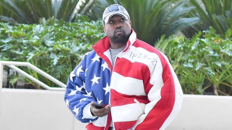 Kanye West wearing American flag jacket