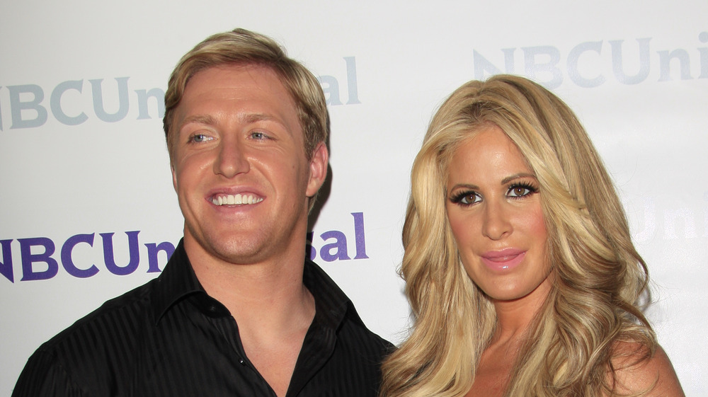 Kory Biermann and Kim Zolciak-Biermann smiling on the red carpet