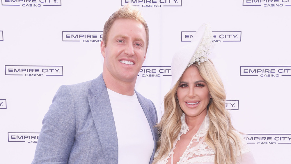 Kroy Biermann and Kim Zolciak-Biermann smiling on the red carpet