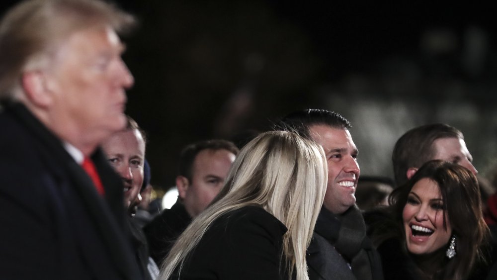 Tiffany Trump, Donald Trump Jr., and Kimberly Guilfoyle all laughing, President Donald Trump in foreground