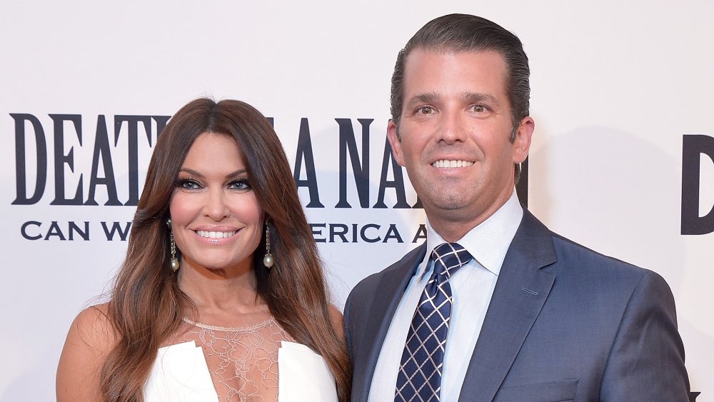 Kimberly Guilfoyle and Donald Trump Jr. posing and smiling