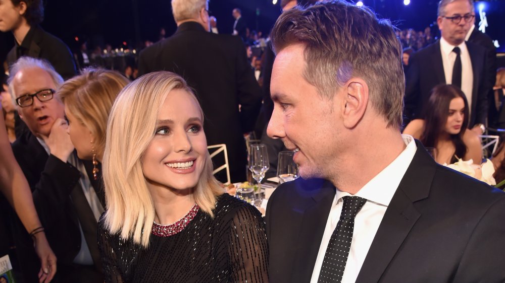 Kristen Bell and Dax Shepard looking at one another