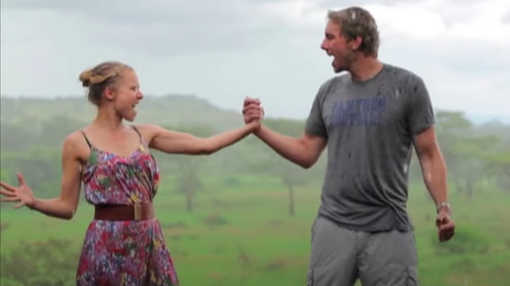 Dax Shepard and Kristen Bell in Africa, holding hands in the rain