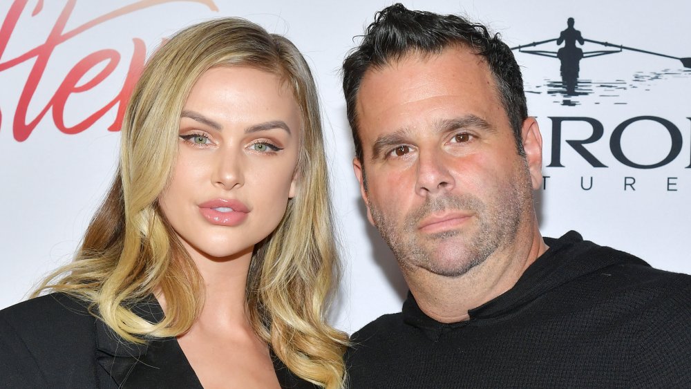 Lala Kent and Randall Emmett, both wearing black and posing together with neutral expressions at the After movie premiere