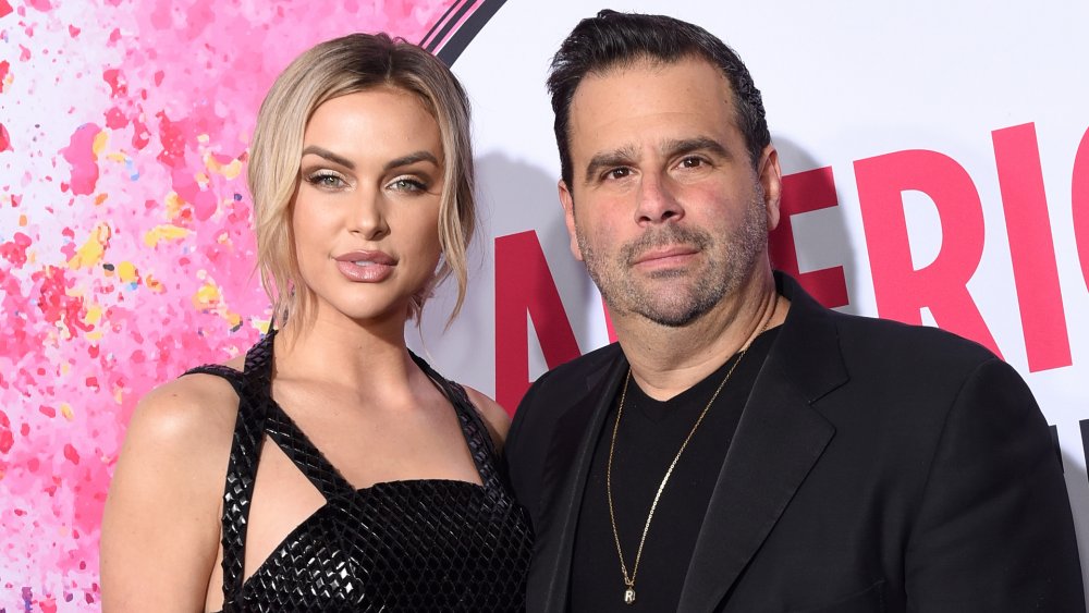 Lala Kent in a black dress, Randall Emmett in a black blazer and t-shirt