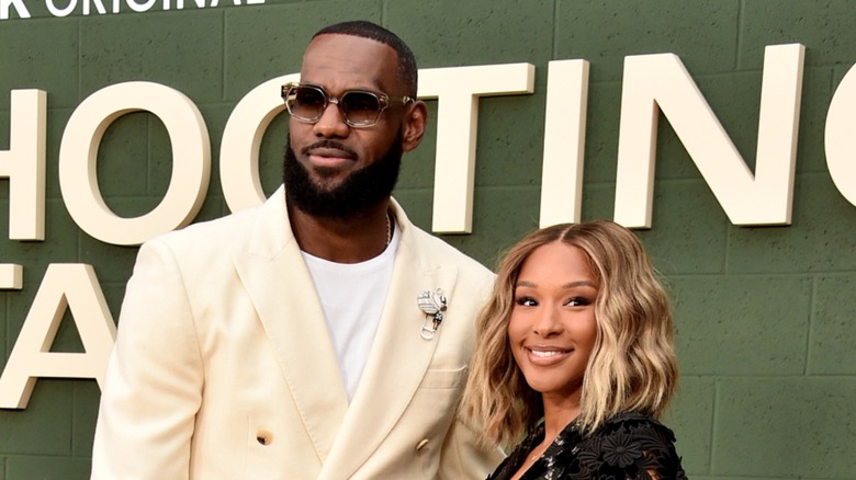 LeBron James and Savannah James pose at an event