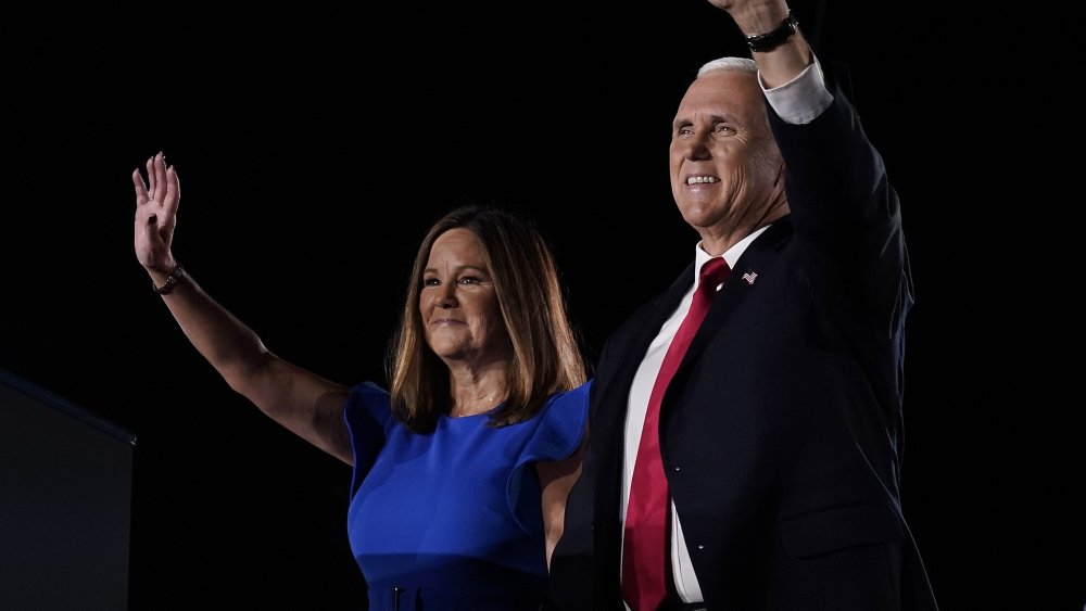 Karen and Mike Pence both waving, smiling