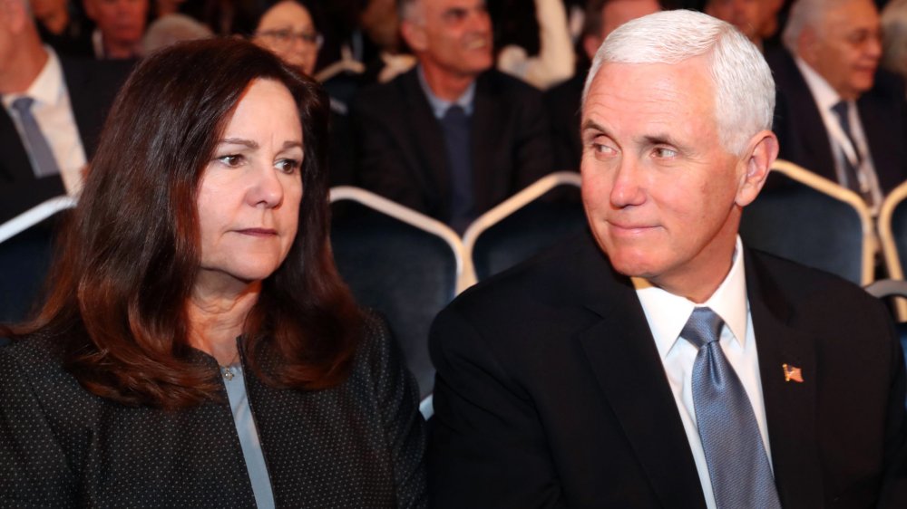 Karen Pence looking forward, Mike Pence looking at her