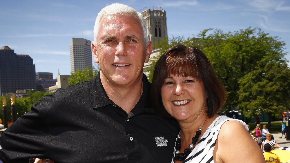 Mike and Karen Pence, arm in arm and smiling