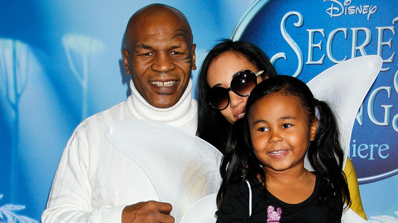 Milan Tyson poses with parents