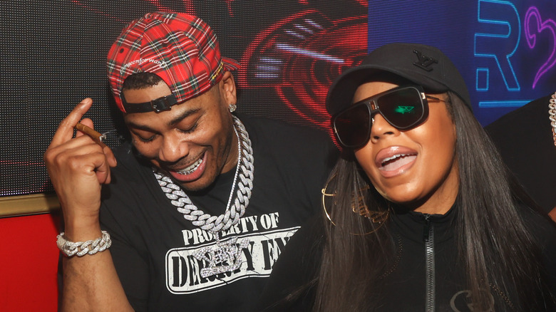 Nelly and Ashanti laughing together