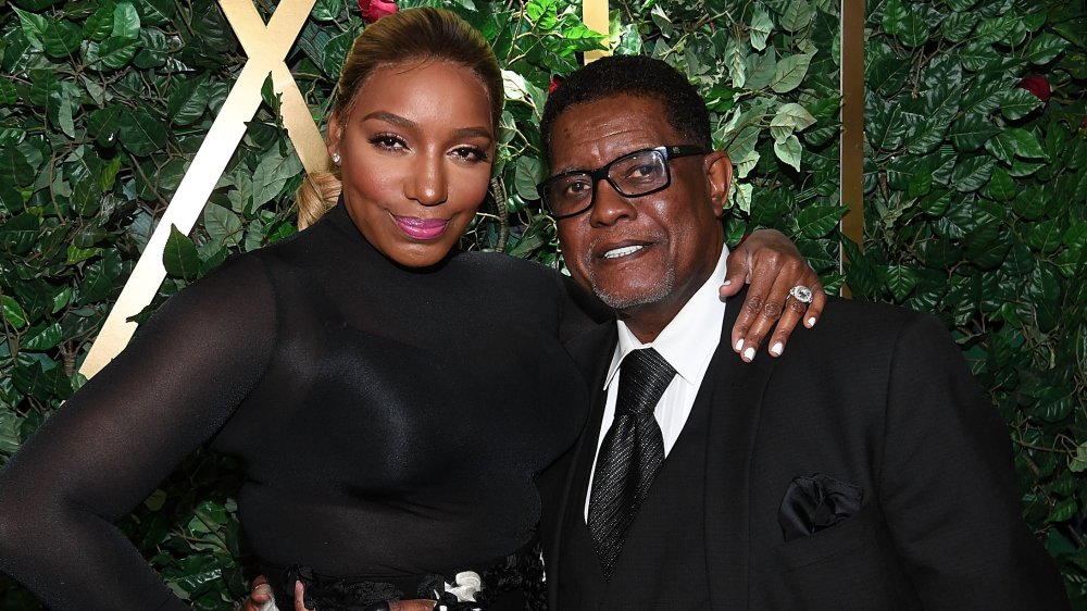 NeNe Leakes and Gregg Leakes, both wearing black