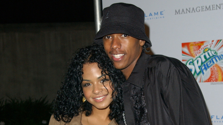 Nick Cannon posing with Christiana Milan