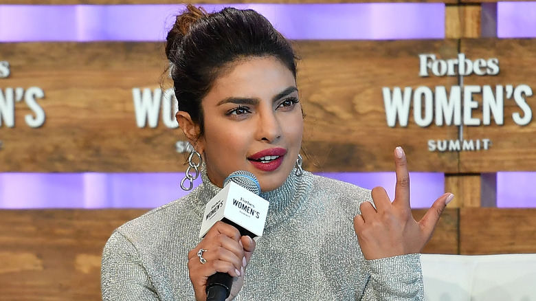 Priyanka Chopra holding a microphone