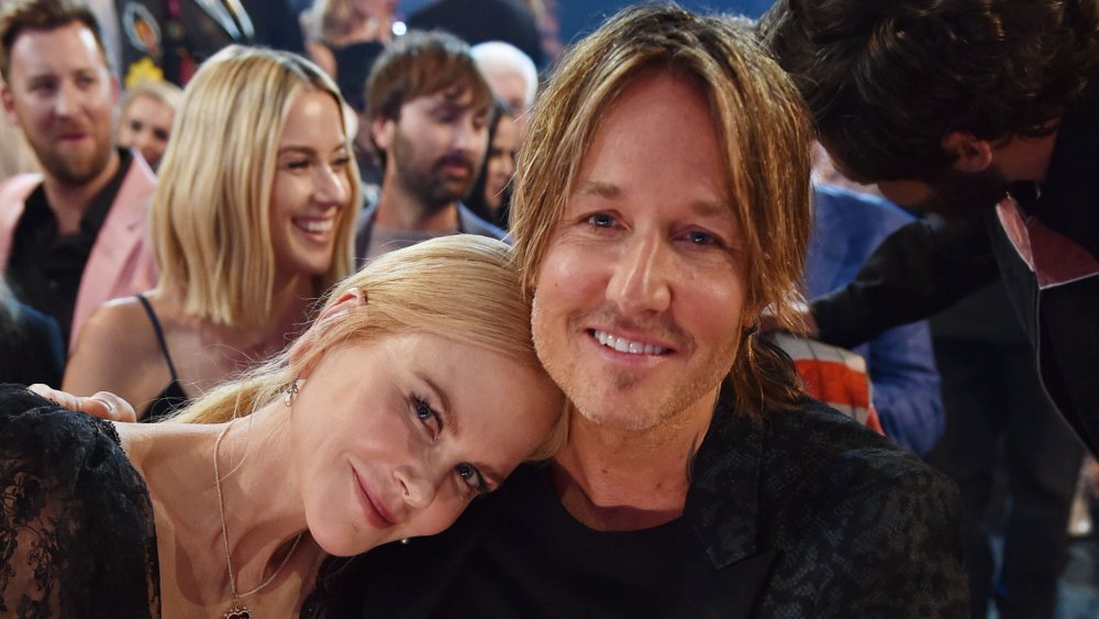 Nicole Kidman leaning her head against Keith Urban's, both smiling