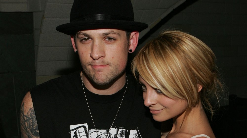 Joel Madden and Nicole Richie in casual clothes at a party in 2007