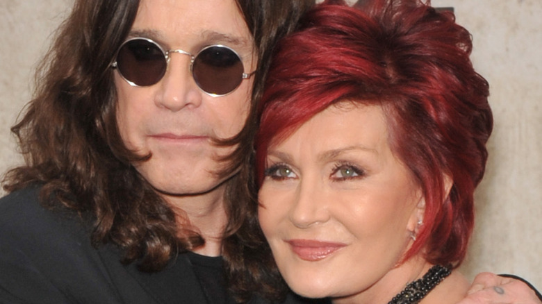 Ozzy and Sharon Osbourne pose on red carpet 