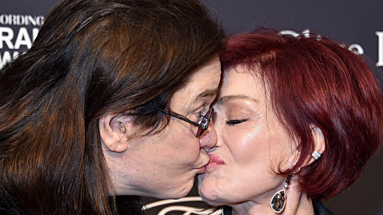 Ozzy Osbourne and Sharon Osbourne kissing