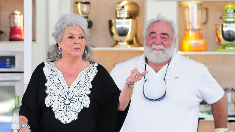 Paula Deen talks next to Michael Groover