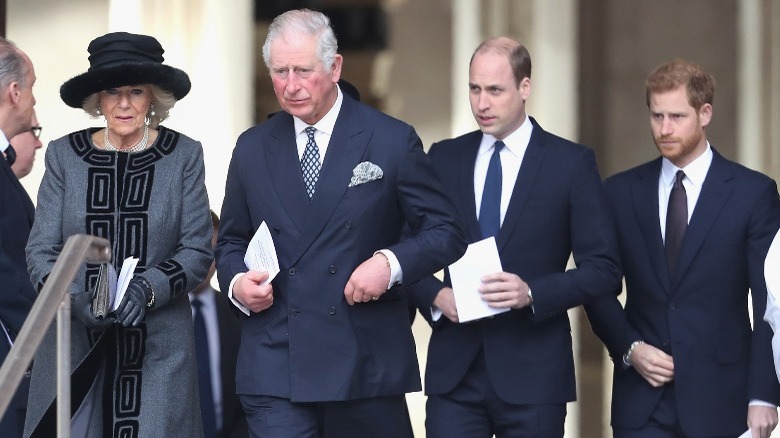 Camilla Parker Bowles, Prince Charles, Prince William, and Prince Harry walking together