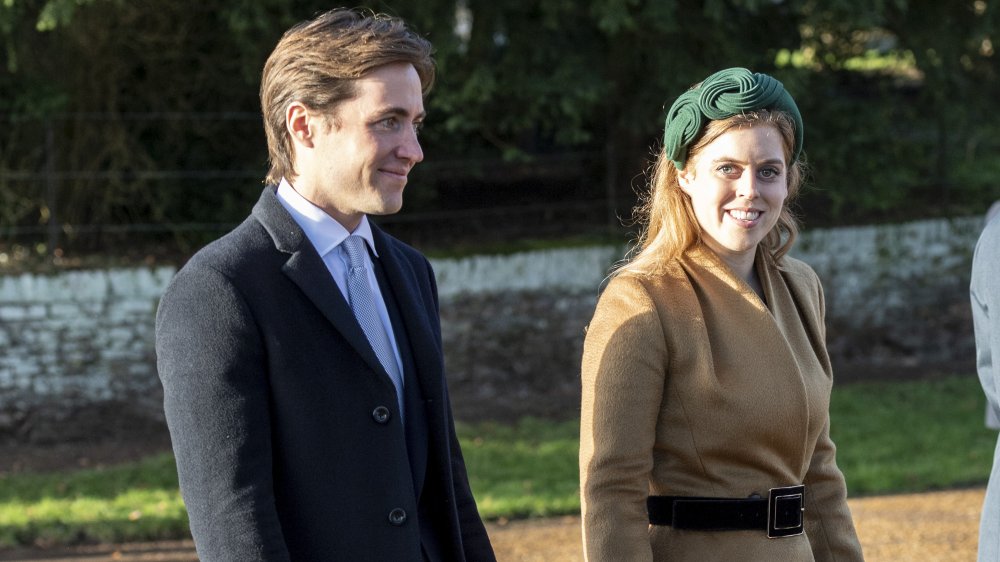 Edoardo Mapelli Mozzi and Princess Beatrice, smiling while walking outside