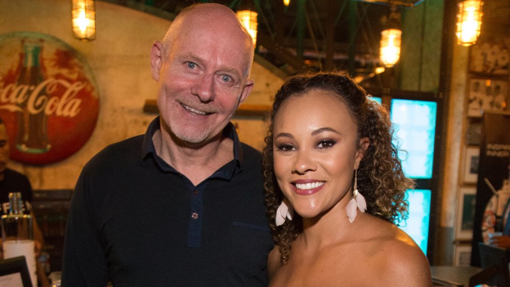 Michael Darby and Ashley Darby, smiling while posing arm in arm