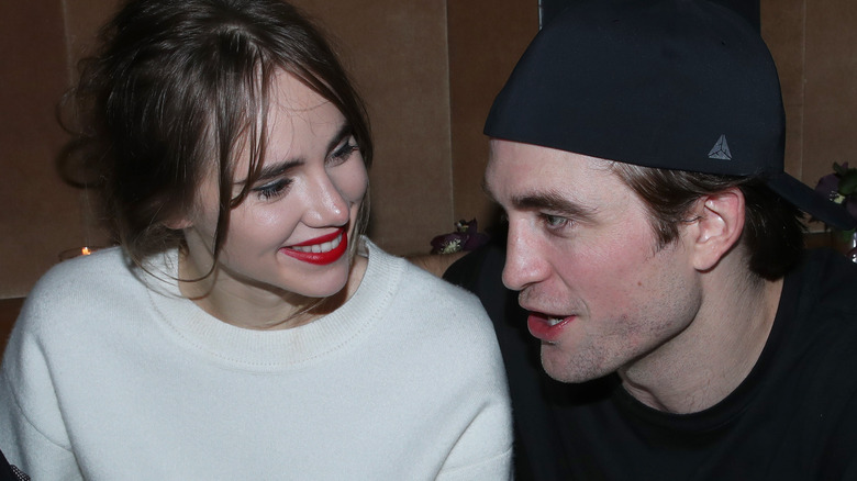 Robert Pattinson and Suki Waterhouse looking at each other