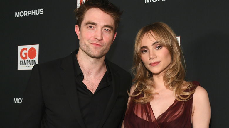 Robert Pattinson and Suki Waterhouse posing together