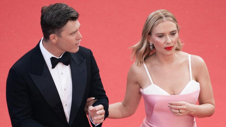 Colin Jost and Scarlett Johansson walking