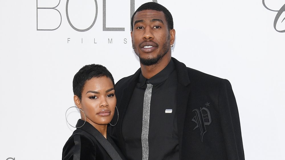 Teyana Taylor and Iman Shumpert, posing arm in arm