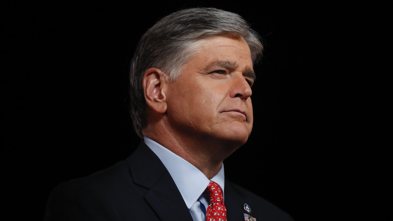 Sean Hannity against black background