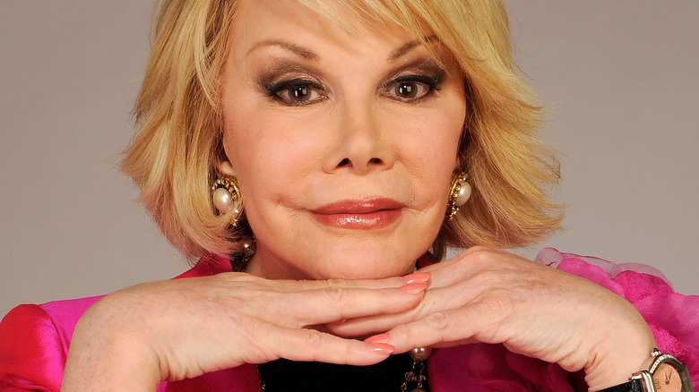 Joan Rivers resting chin on hands 