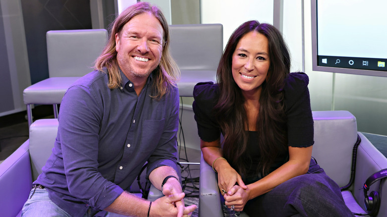 Chip and Joanna Gaines seated smiling