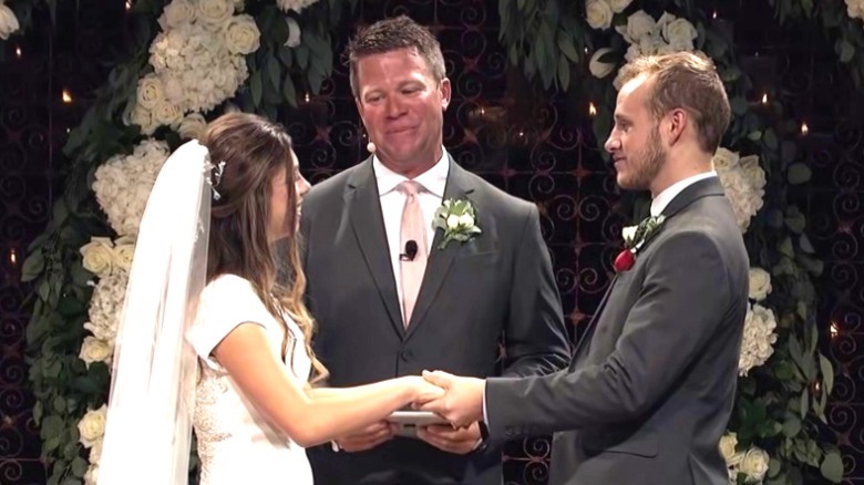 Josiah and Lauren Duggar getting ready for their first kiss at wedding